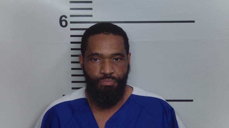Convicted felon already in jail charged in Russell neighborhood shooting