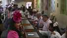 A person places a bet at Churchill Downs before the 151st running of the Kentucky Oaks horse race Friday, May 2, 2025, in Louisville, Ky. (AP Photo/Jon Cherry)