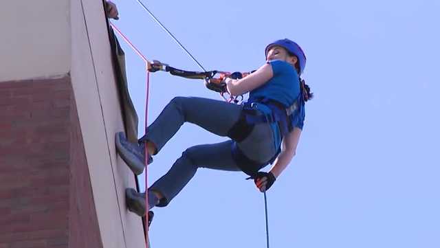 People rappel down Lancaster building for VisionCorps fundraiser