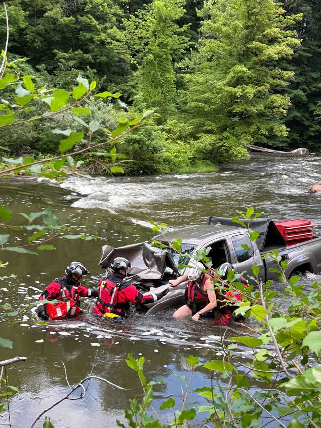 members of chester fire department rescue driver from ﻿black river