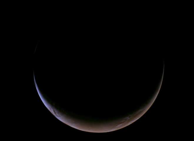 This view of a crescent Mars was captured on May 15 by the Psyche spacecraft.