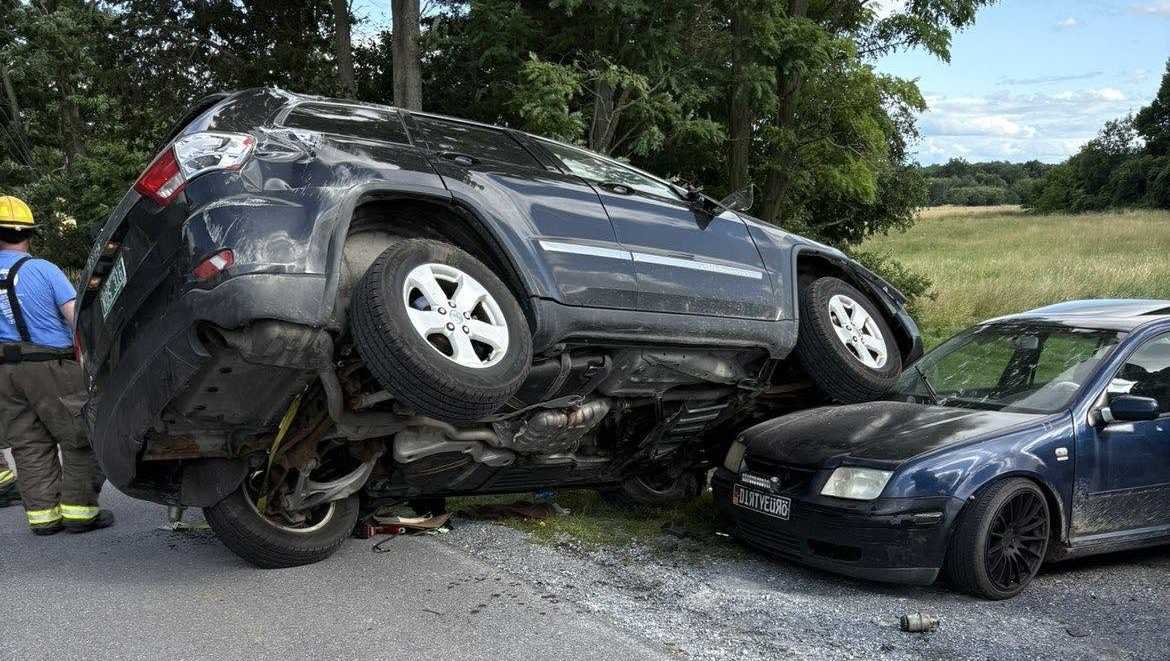 Driver hits utility pole, lands on top of parked car in Addison County