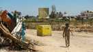 Israel is building a miles-long earthen barrier dividing Gaza