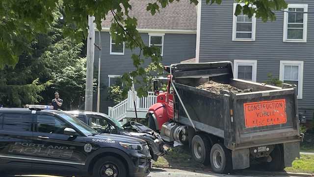 Multiple vehicles damaged in crash involving a dump truck in Portland, Maine