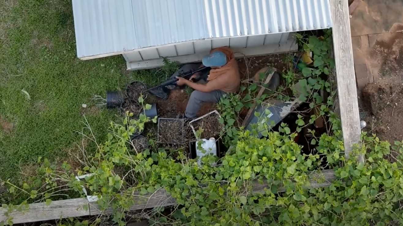 Drone video shows armed man hiding behind neighbor's shed during hourslong standoff