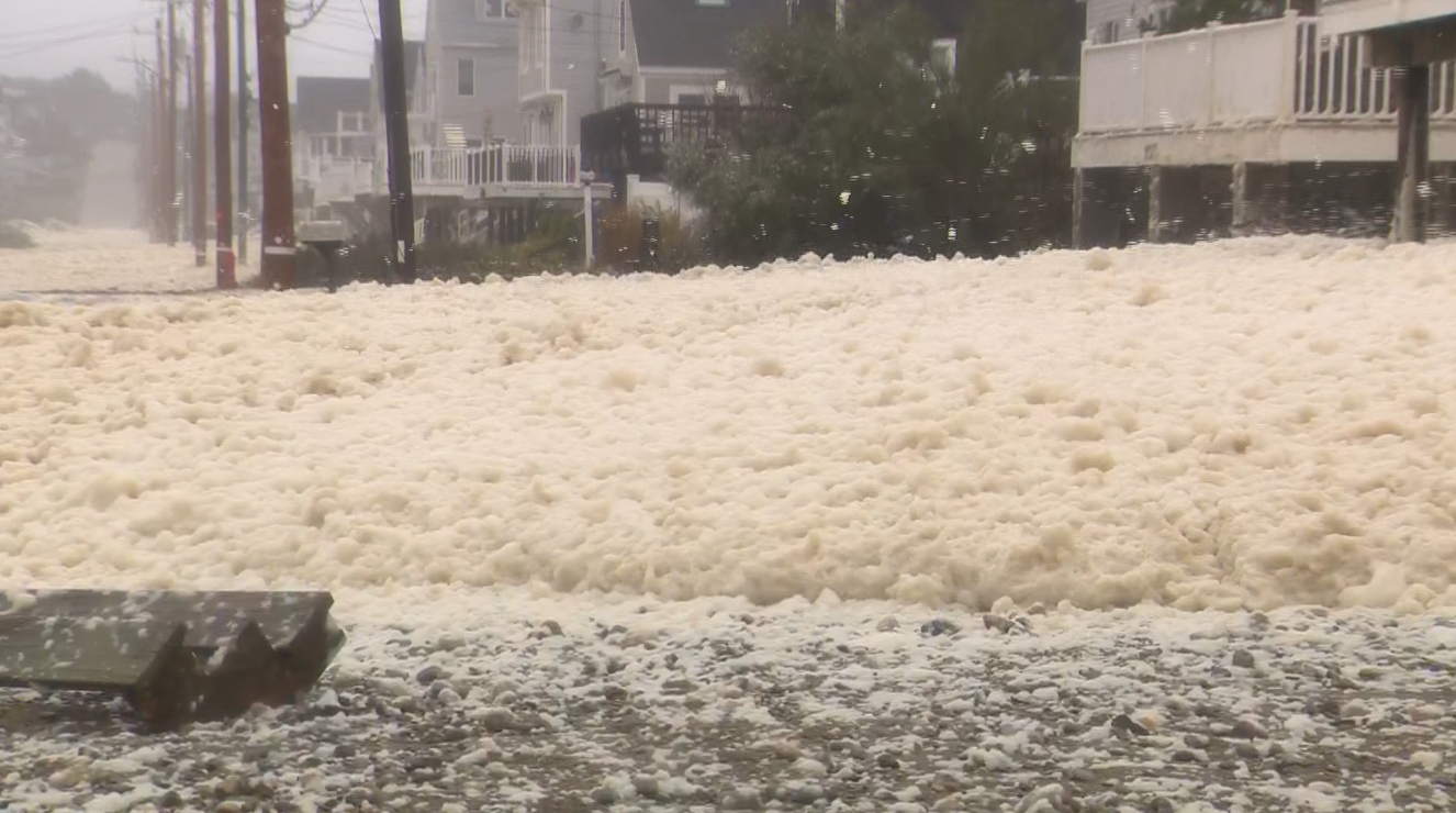 Seafoam covers streets in coastal Massachusetts community battered by nor'easter
