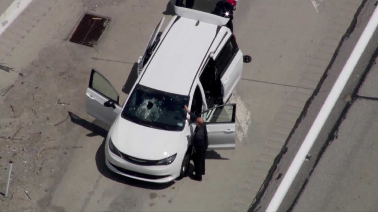 Search for driver after metal flies off trailer, smashes windshield on I-70