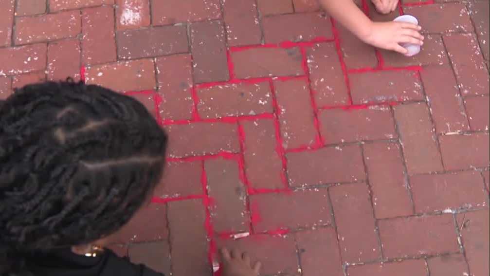 Lancaster event uses red sand to highlight human trafficking awareness