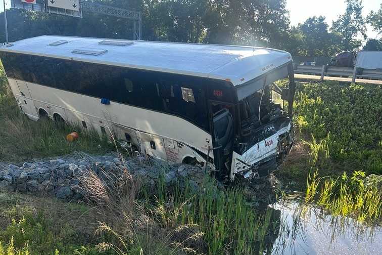 Bus hits cars on I-95, killing 5 people and injuring 34, police say