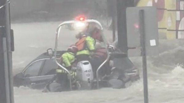 Cincinnati firefighters rescue couple from car trapped in floodwaters