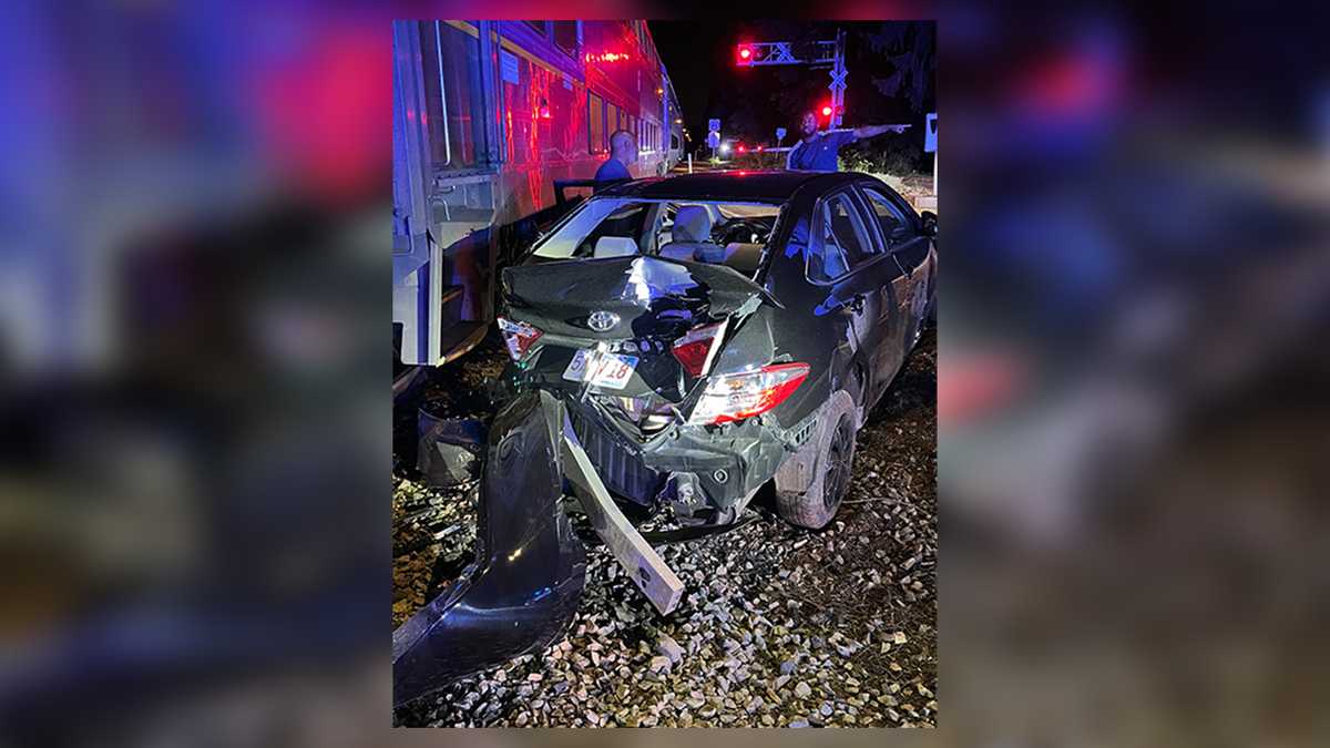 Delivery driver's vehicle struck by Commuter Rail train after getting stuck on tracks