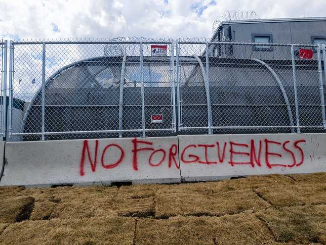NEWARK, NEW JERSEY - JUNE 21: Graffiti covers walls around the Delaney Hall Detention Center as pro immigration activists continue to protest outside of the Delaney Hall Detention Facility, and clash with ICE agents, June 21, 2026 in Newark, New Jersey. Though it was Father's Day,  visitations were cancelled for families trying to see their detained relatives. (Photo by Andrew Lichtenstein/Corbis via Getty Images)