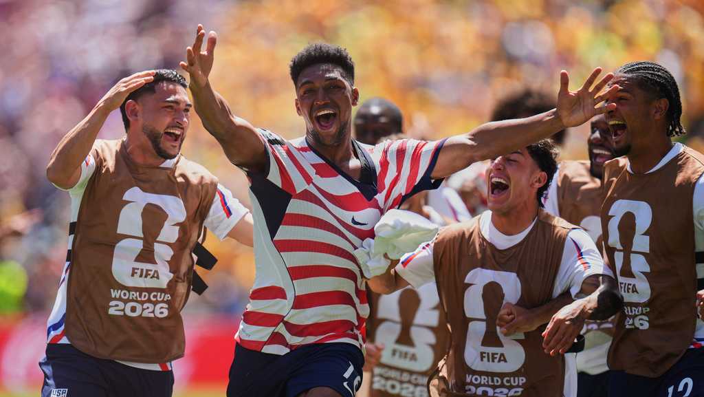US reaches World Cup knockout round and wins its group with 2nd straight victory