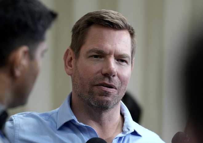 California gubernatorial candidate Rep. Eric Swalwell, D-Calif., talks with reporters after holding a town hall meeting in Sacramento, Calif., Tuesday, April 7, 2026.