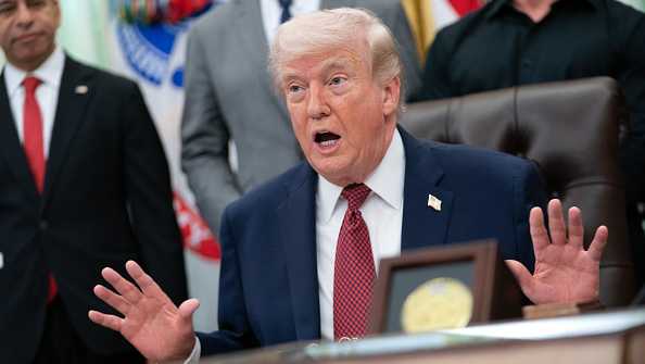 WASHINGTON, DC - APRIL 18: U.S. President Donald Trump makes an announcement on researching the effects of psychedelic drugs in medical treatment for veterans, on Saturday, April 18, 2026 in the Oval Office at the White House in Washington, D.C. HHS Secretary Robert F. Kennedy Jr., podcast host Joe Rogan, Rep. Morgan Luttrell (R-Texas) and retired Navy SEAL Marcus Luttrell were among those who joined Trump. (Photo by Allison Robbert/For The Washington Post via Getty Images)