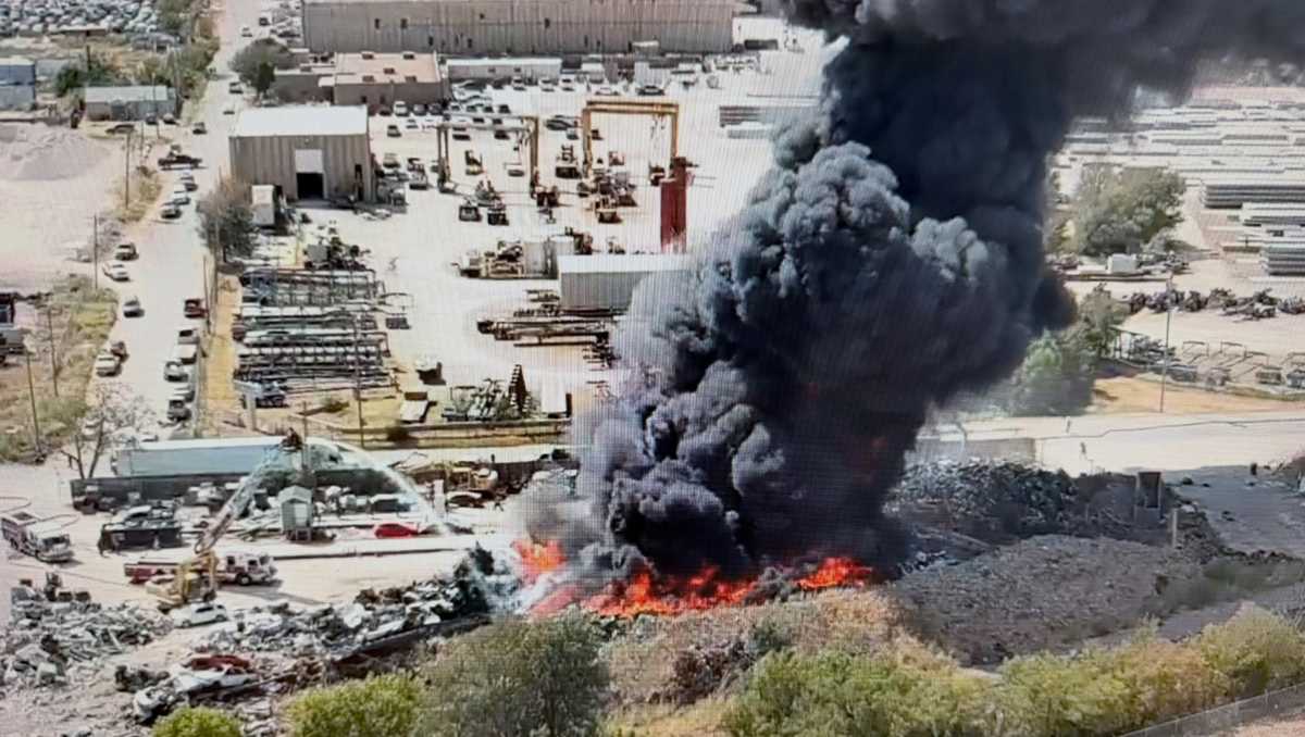 Crews battle Oklahoma City recycling plant fire as huge black cloud fills the sky