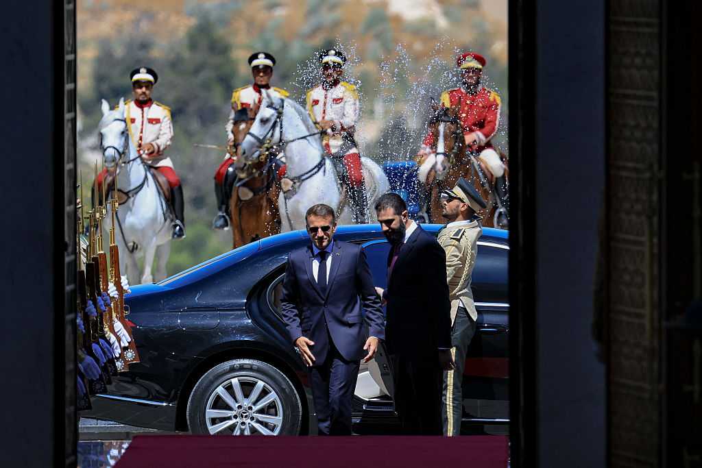 Explosions rock Damascus, wounding 18, as French President Macron visits Syria