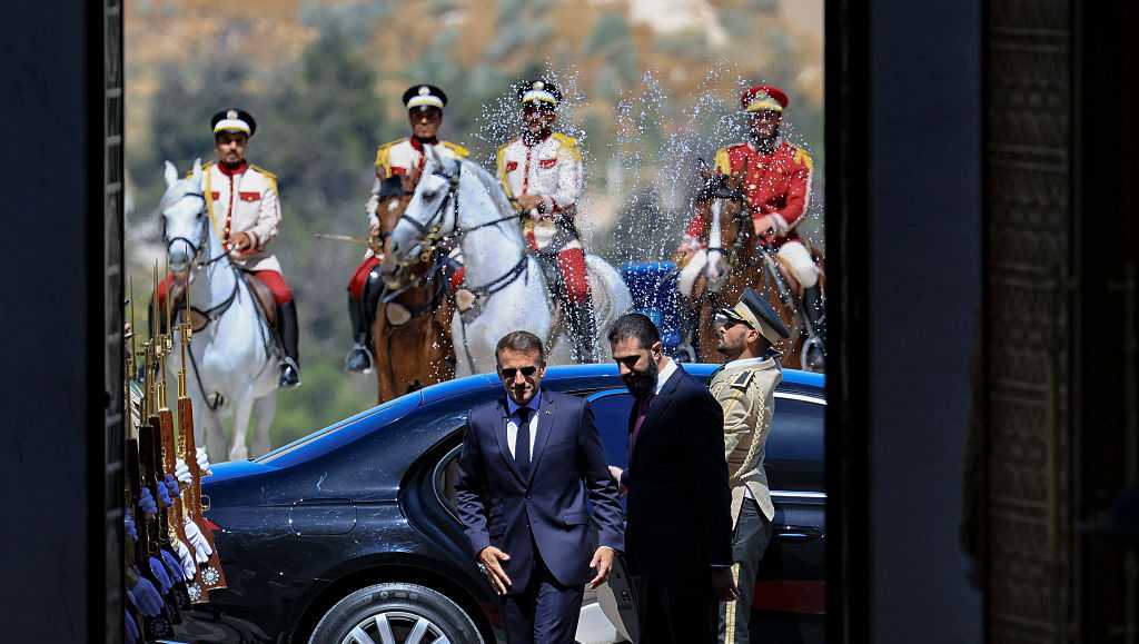 Explosions rock Damascus, wounding 18, as French President Macron visits Syria