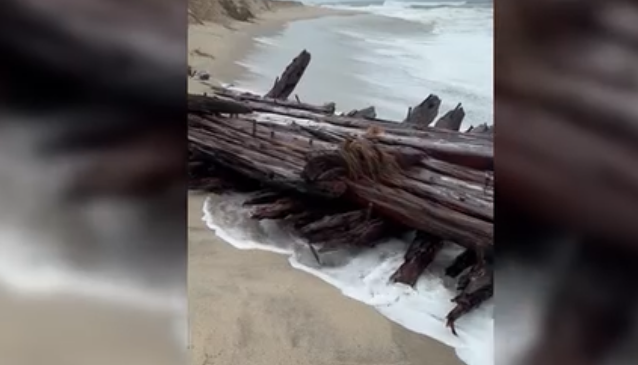 Believed 1884 shipwreck washes onto shore during nor'easter rain, flooding