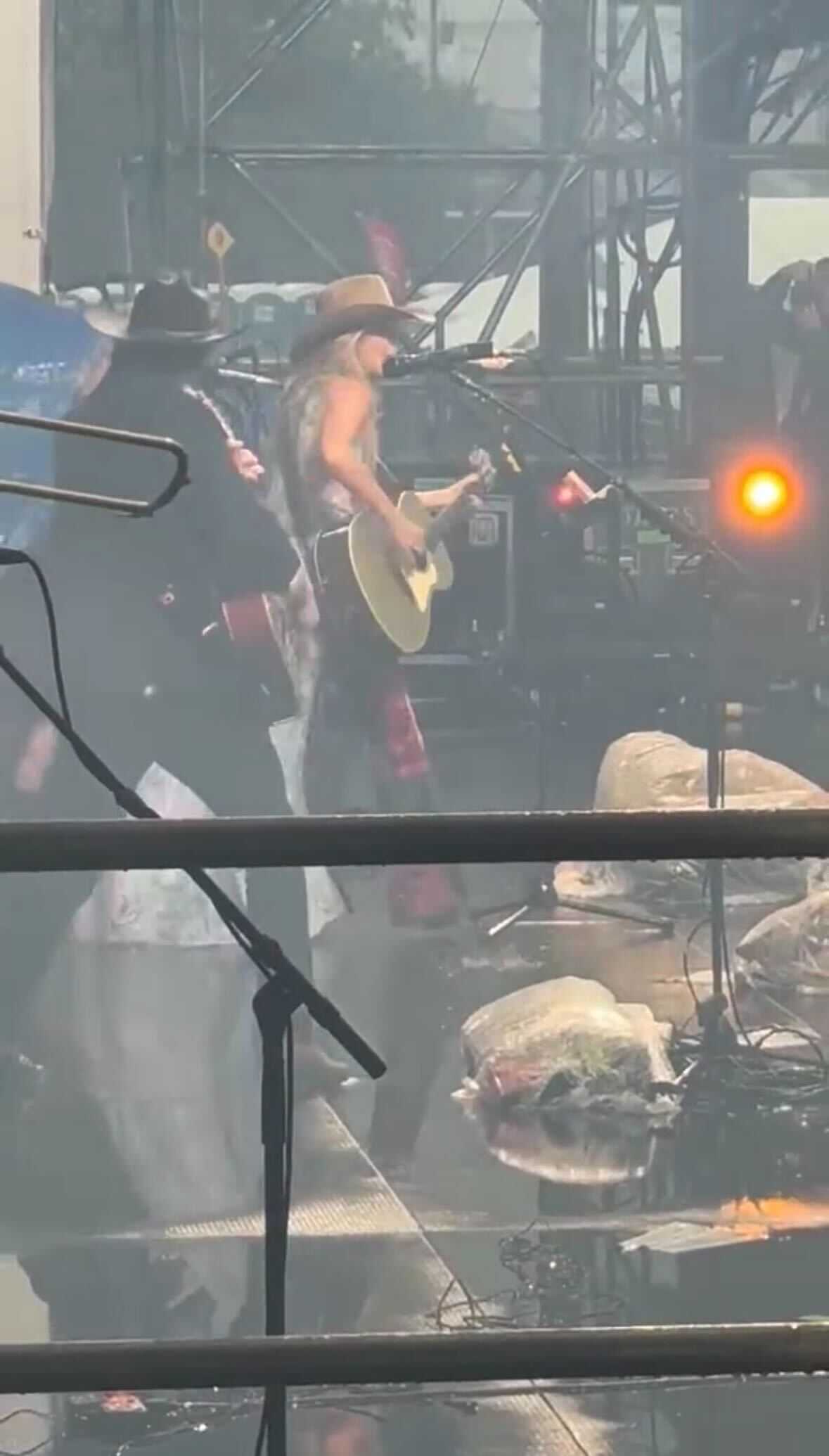 Watch Lainey Wilson give it her all in the pouring rain at Jazz Fest in New Orleans