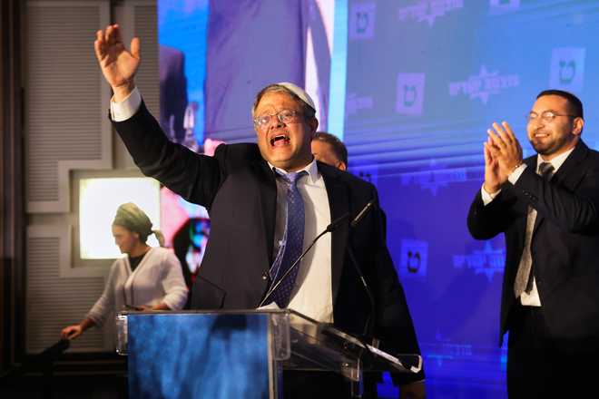 FILE - Israeli far-right lawmaker Itamar Ben-Gvir gestures after election exit poll results are released at his party's headquarters in Jerusalem on Nov. 2, 2022.