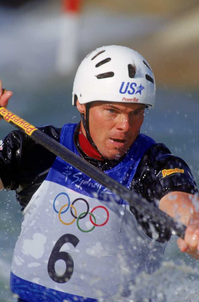 David Hearn of the USA navigates the course during the men's canoeing slalom C-1 qualification event for the 2000 Sydney Olympics at the Penrith Whitewater Course in Sydney, Australia on Sept. 17, 2000.
