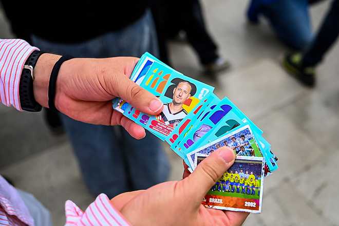 09 June 2026, Mexico, Mexiko Stadt: A person is holding Panini stickers. Waldemar Anton (Germany) can be seen on one sticker. The opening match of the 2026 World Cup will take place on June 11 in Mexico City. Photo: Tom Weller/dpa (Photo by Tom Weller/picture alliance via Getty Images)