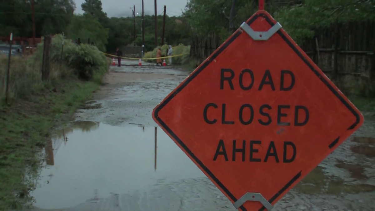 Arroyo overflows in Santa Fe County causing a road to collapse and cuts off access to homes