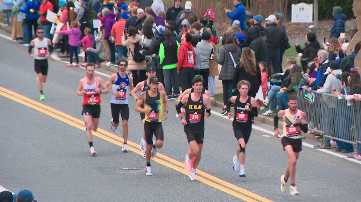 Fans line streets to power athletes along as they race Boston Marathon