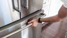 Man Opens Freezer Door