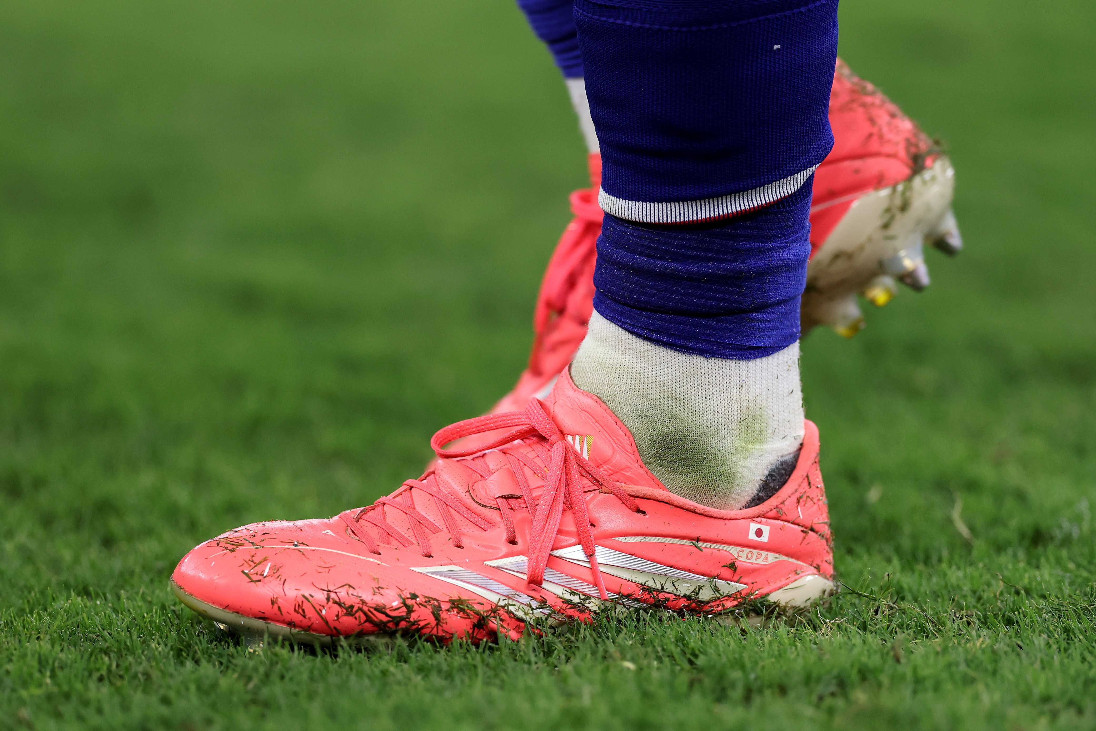 Why are so many players in the World Cup wearing pink cleats?