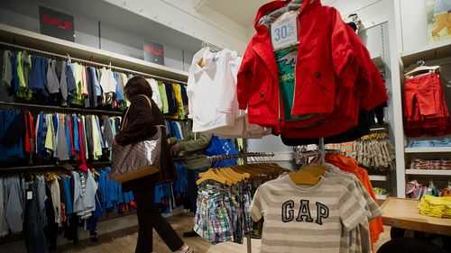 You know the economy is hurting families when they stop buying baby clothes. A customer here shops for children's clothes at a Gap store in San Francisco, on February 28, 2013.