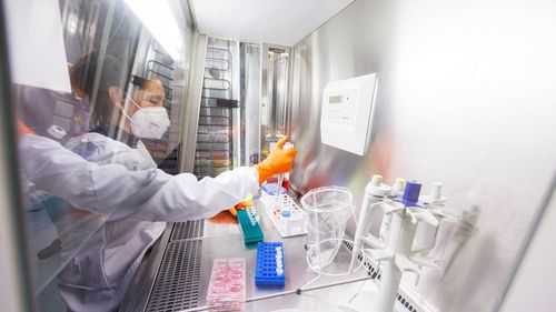 An employee works on a vaccine based on the monkeypox vaccine that has already been developed by the vaccine company Bavarian Nordic at a laboratory of the company in Martinsried near Munich, Germany, May 24, 2022.