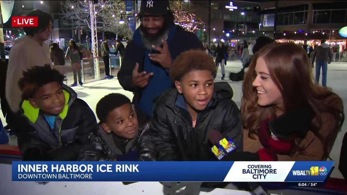 Families celebrate Christmas at Baltimore's Inner Harbor Ice Rink