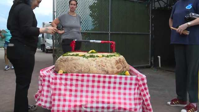 VIDEO: A minor league baseball team rolls out world's largest crab cake, then feeds it to fans