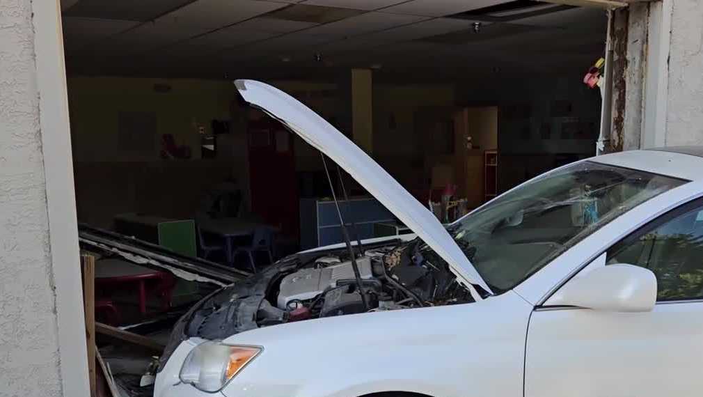 Man arrested after car crashes into Des Moines day care building - KCCI