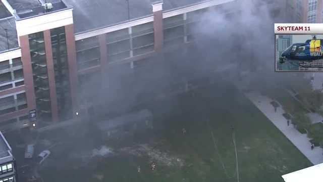 Crews extinguish vehicle fire in parking garage