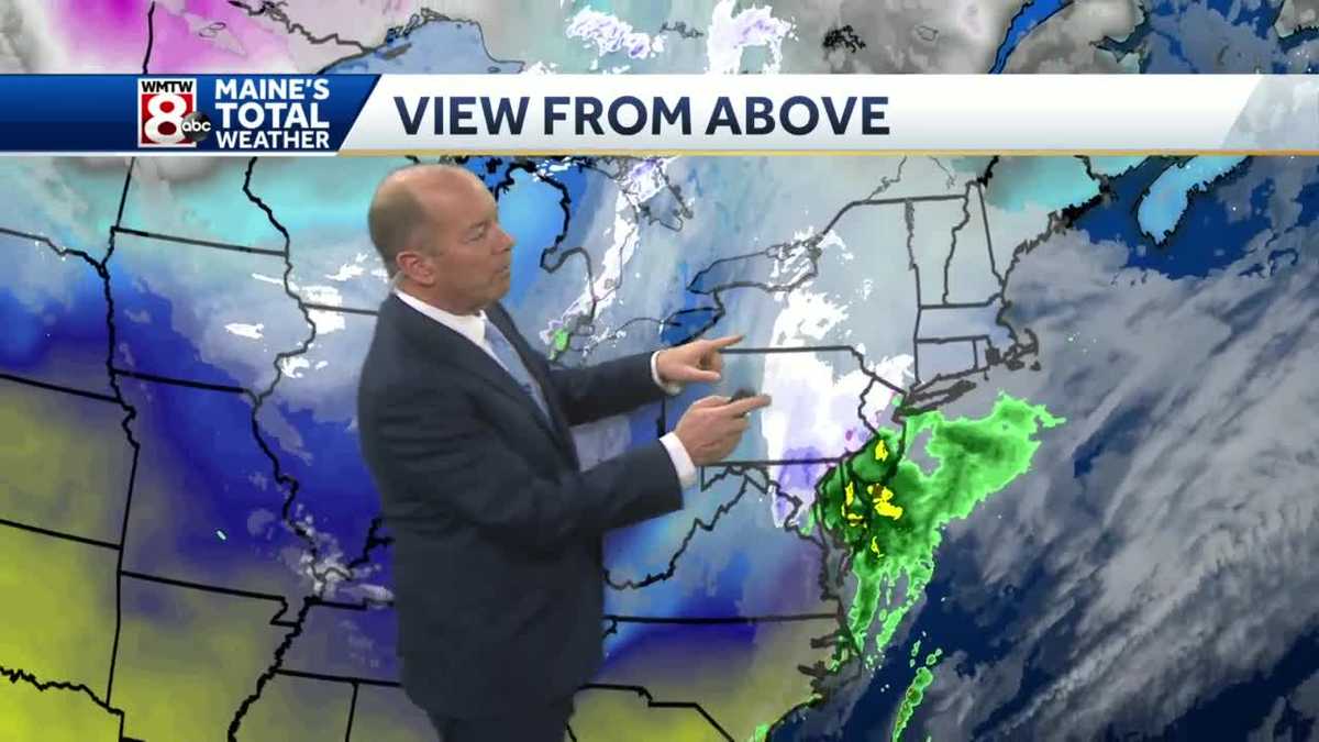 Morning snow showers with a mix of sun and clouds after noon