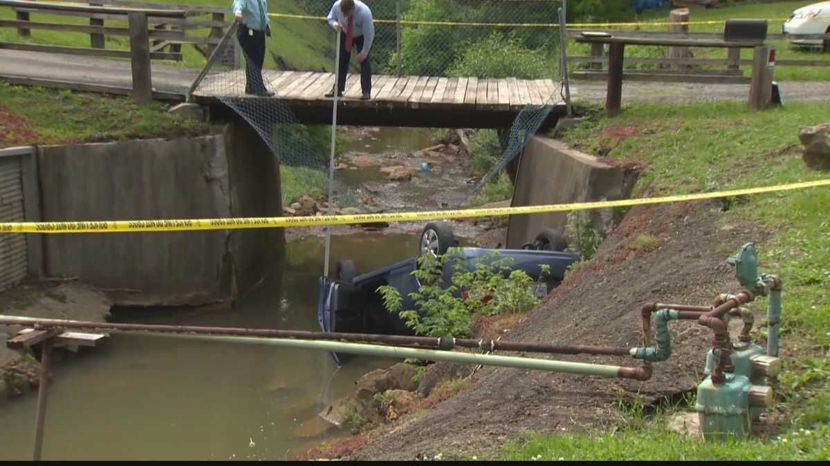 Driver pronounced dead after car lands on roof in creek