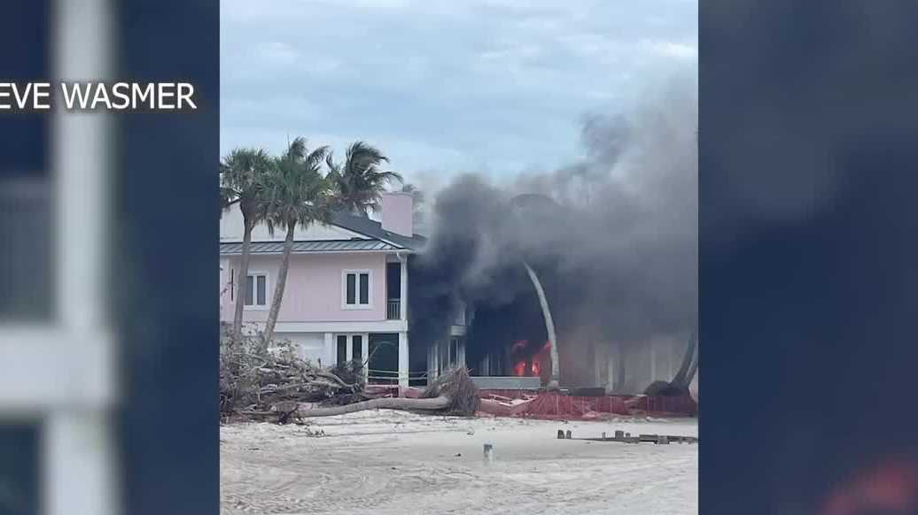 Smoke pours out of Naples home along Gordon Drive