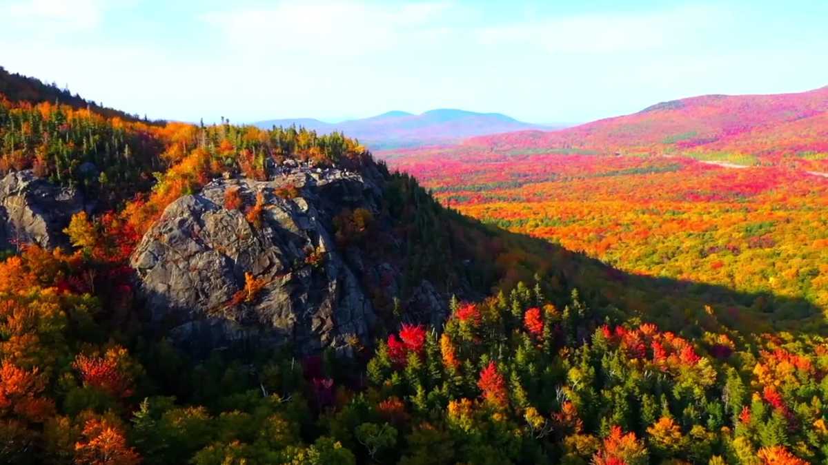 aerial footage of fall colors over Artists Bluff in Franconia