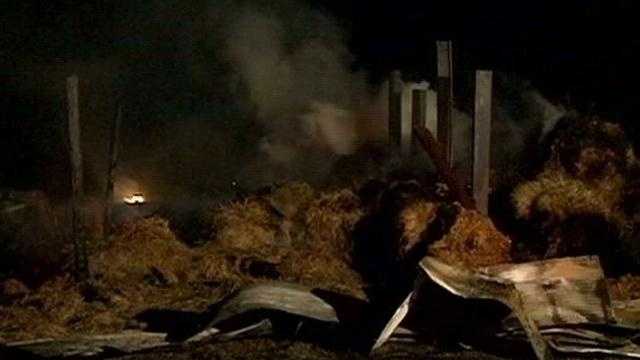 Fire destroys barn, dozens of hay bails