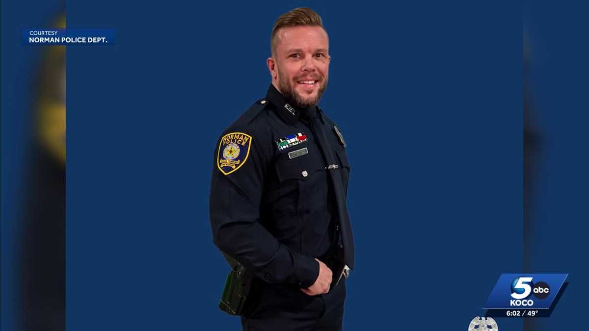 Norman officer remains in critical condition after highway collision