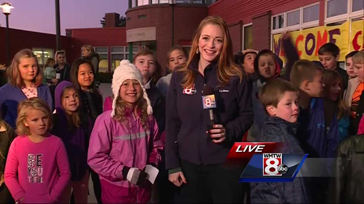 Students at Stevens Brook Elementary deliver chilly bus stop forecast