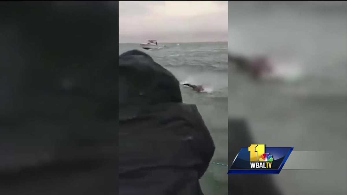 Video: Rescuers pull man from frigid waters after his boat capsizes