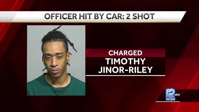 Man charged with hitting police officer, pinning him against car - Vimarsana News