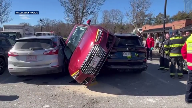 Car wedged between vehicles after Wellesley parking lot crash - Vimarsana News