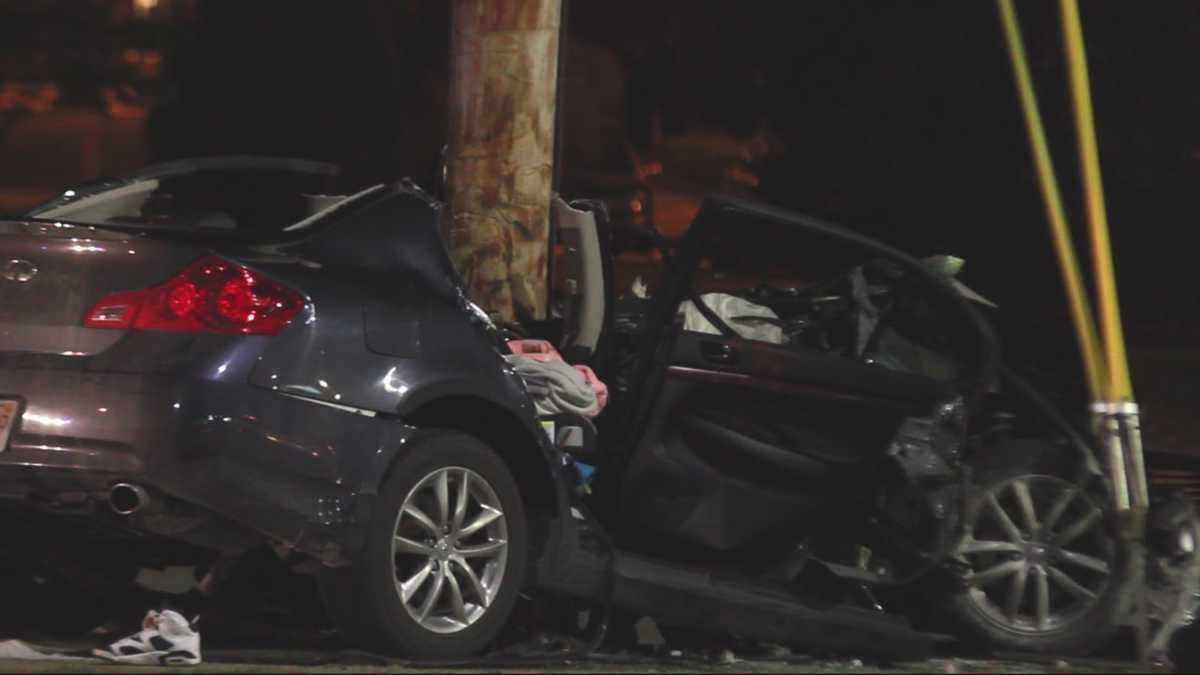 Violent crash splits car after striking utility pole