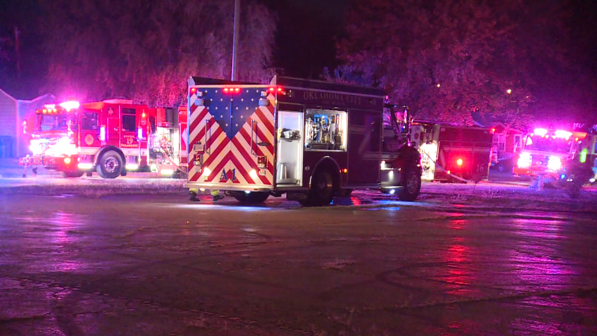OKC crews put out flames after car inside shed catches fire