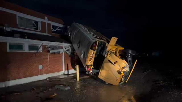 VIDEO: Bus on roof of Alabama high school after possible tornado